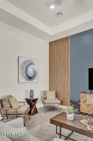 a living room with furniture and a large window