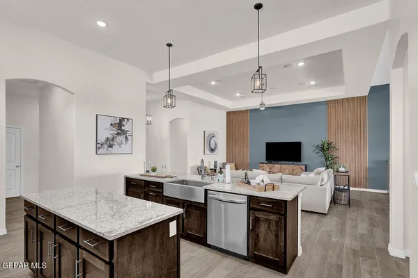 a work room with furniture and large window