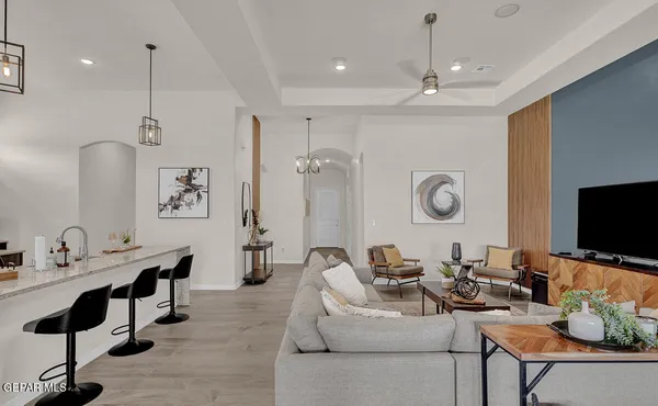 a living room with fireplace furniture and a flat screen tv