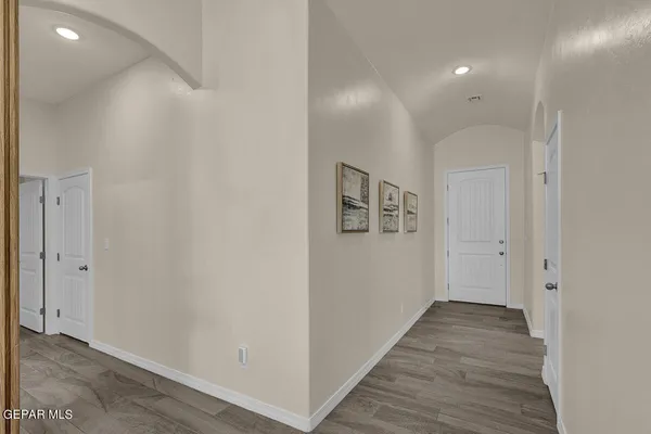 a bathroom with a granite countertop sink toilet a mirror and shower