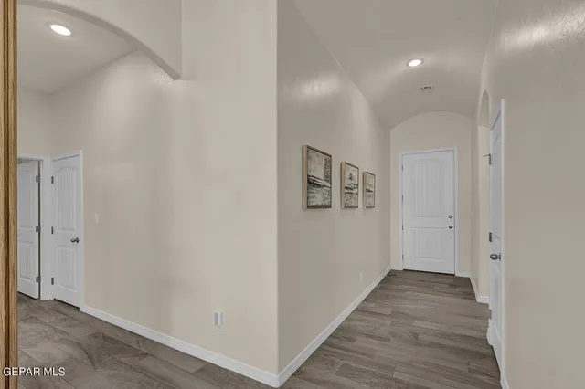 a bathroom with a granite countertop sink toilet a mirror and shower