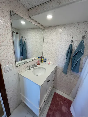a bathroom with a sink and a shower