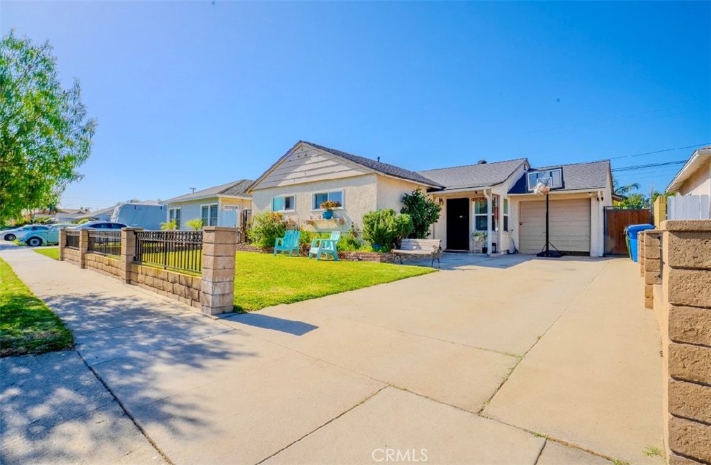 10539 Gridley Road Santa Fe Springs, CA 90670 - Photo 15 of 27 a front view of a house with garden