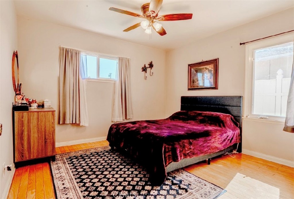 10539 Gridley Road Santa Fe Springs, CA 90670 - Photo 19 of 27 a bedroom with a bed and a window