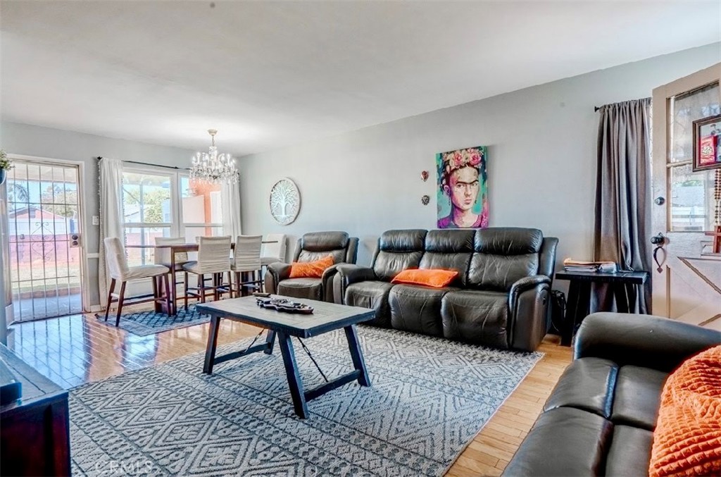 10539 Gridley Road Santa Fe Springs, CA 90670 - Photo 27 of 27 a living room with furniture a rug and a window