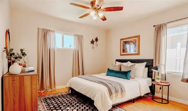 a bedroom with a bed and a window