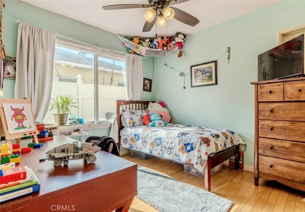 10539 Gridley Road Santa Fe Springs, CA 90670 - Photo 7 of 27 a bedroom with bed and a window