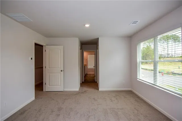 a view of a bathroom from a hallway