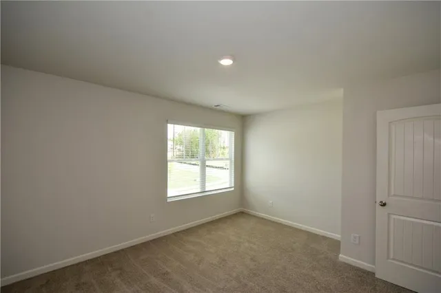 a bathroom with a granite countertop sink shower and a mirror
