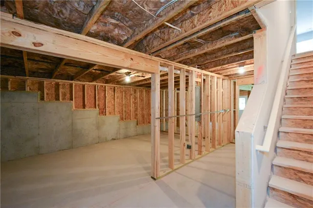 a view of empty room with wooden walls