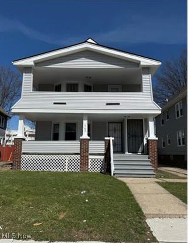 1743 Algonac Road Cleveland, OH 44112 - Photo 2 of 19 View of front of house featuring a porch and a front lawn
