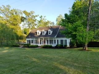 1216 Camp Ravine Road Burns, TN 37029 - Photo 1 of 20 a view of a house with a garden