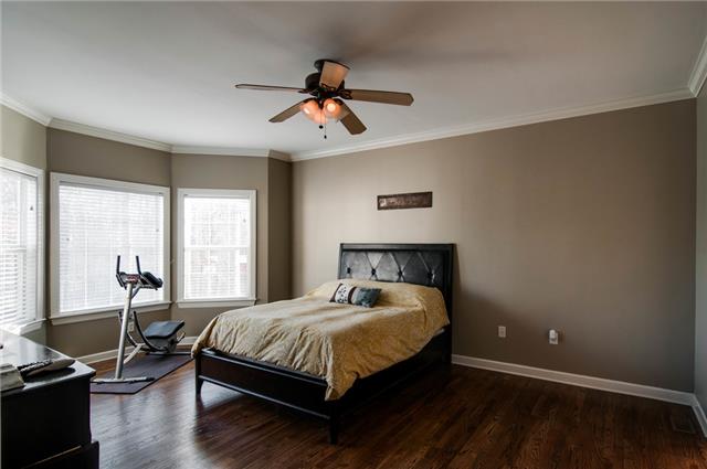 1216 Camp Ravine Road Burns, TN 37029 - Photo 12 of 20 a bedroom with a bed and wooden floor