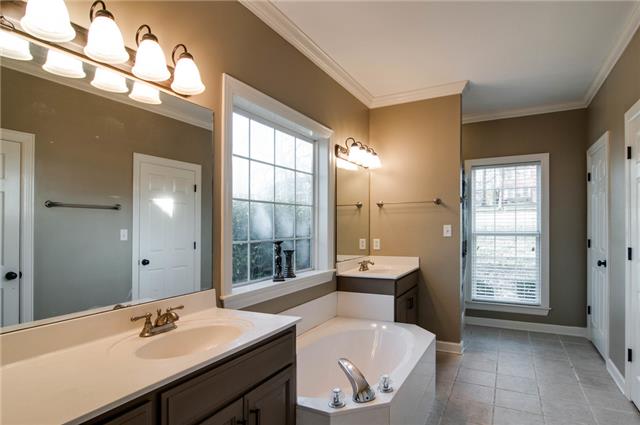 1216 Camp Ravine Road Burns, TN 37029 - Photo 13 of 20 a en suite bathroom with a sink shower and a mirror