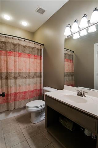 1216 Camp Ravine Road Burns, TN 37029 - Photo 16 of 20 a bathroom with a sink a toilet and shower