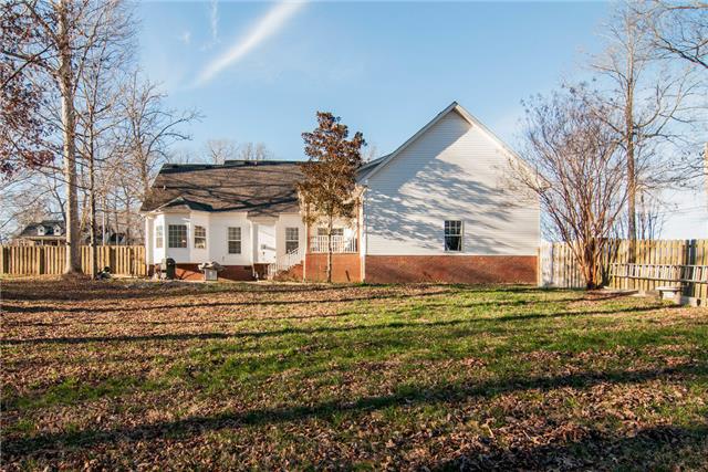 1216 Camp Ravine Road Burns, TN 37029 - Photo 19 of 20 a view of a house with a yard