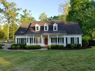 1216 Camp Ravine Road Burns, TN 37029 - Photo 2 of 20 a front view of a house with a garden