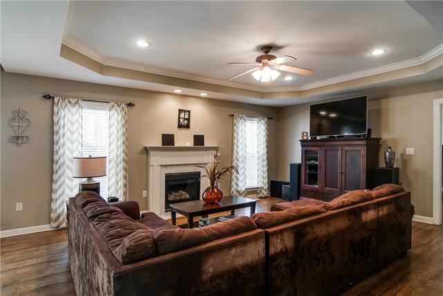 1216 Camp Ravine Road Burns, TN 37029 - Photo 9 of 20 a living room with furniture and a fireplace