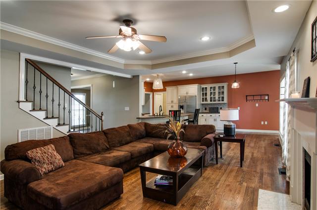 1216 Camp Ravine Road Burns, TN 37029 - Photo 10 of 20 a living room with furniture and a chandelier