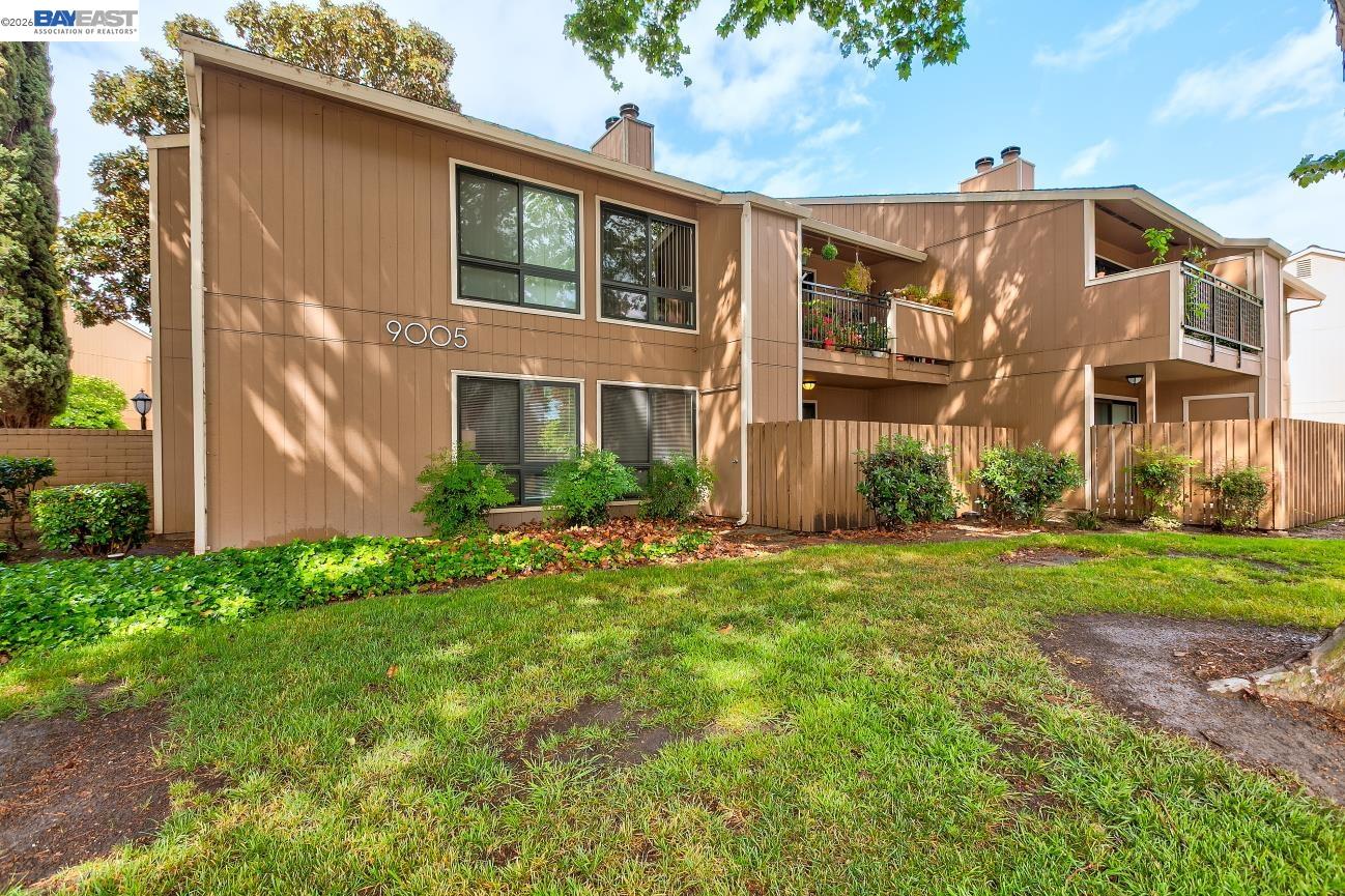 9005 Alcosta Boulevard, Unit 199 San Ramon, CA 94583 - Photo 1 of 57 a view of a big yard in front of a brick house with windows