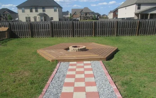 a view of backyard with wooden fence