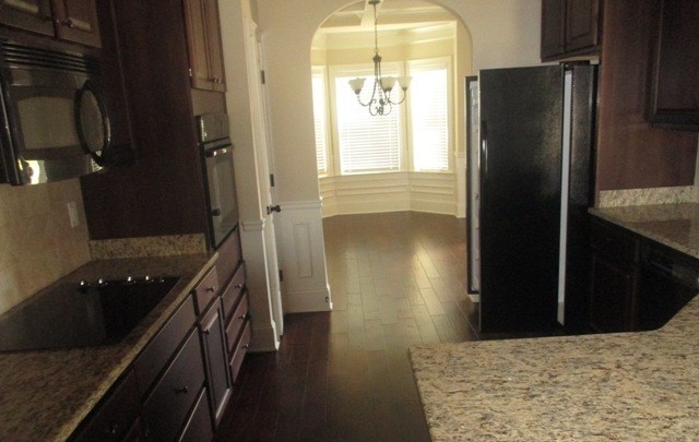 27 Sword Street Fort Mitchell, AL 36856 - Photo 4 of 17 a kitchen with a refrigerator and a stove