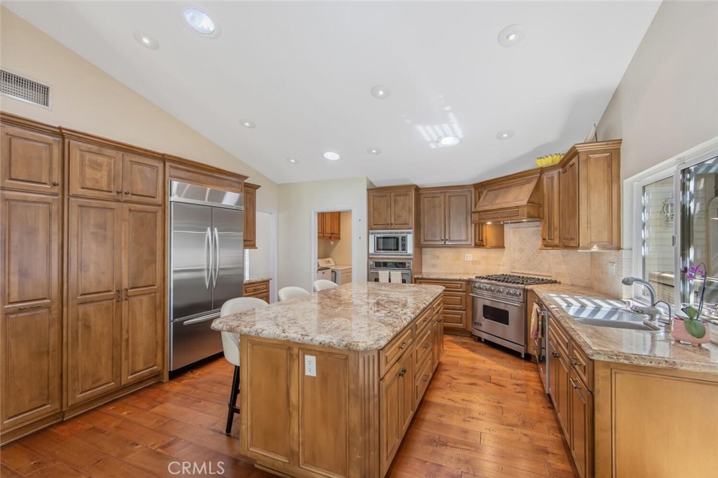 12738 Rosedale Court Camarillo, CA 93012 - Photo 23 of 66 a kitchen with stainless steel appliances granite countertop a sink stove and refrigerator