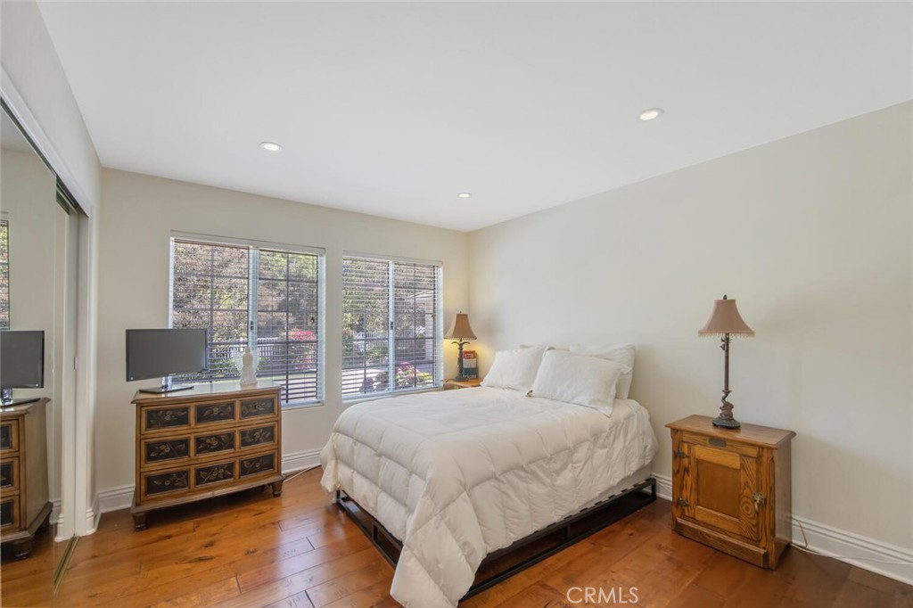 12738 Rosedale Court Camarillo, CA 93012 - Photo 27 of 66 a bedroom with a bed and a flat tv screen on the dresser