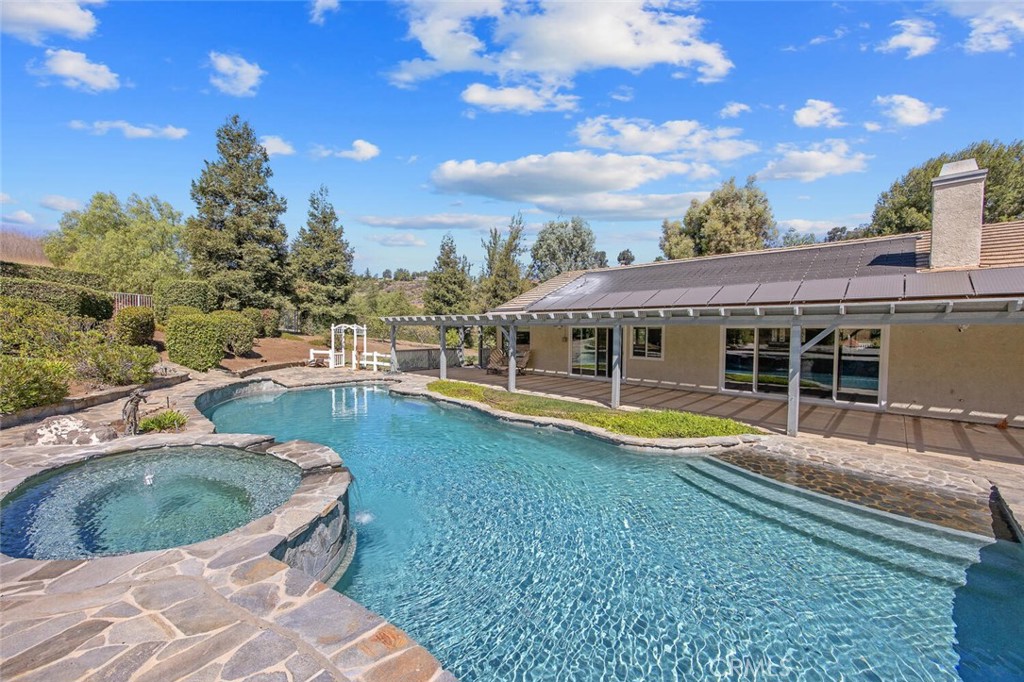 12738 Rosedale Court Camarillo, CA 93012 - Photo 50 of 66 a view of a swimming pool with an outdoor seating