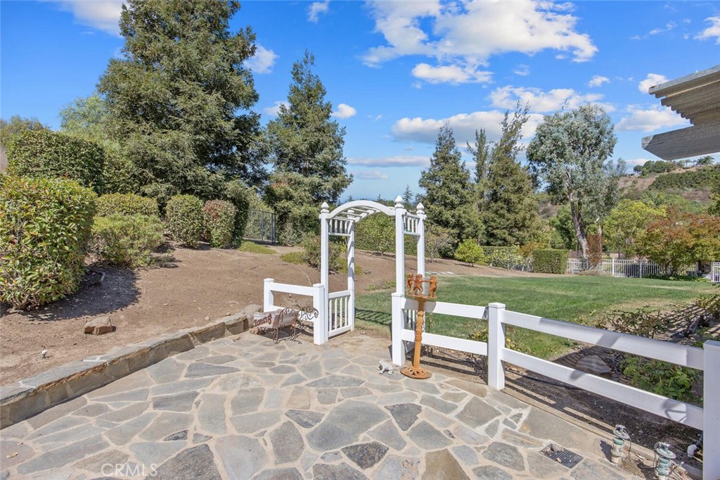 12738 Rosedale Court Camarillo, CA 93012 - Photo 52 of 66 a view of a bench in a yard with wooden fence