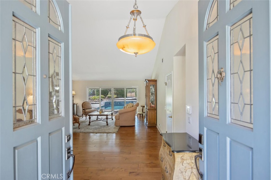 12738 Rosedale Court Camarillo, CA 93012 - Photo 8 of 66 a dining room with chandelier fan and wooden floor