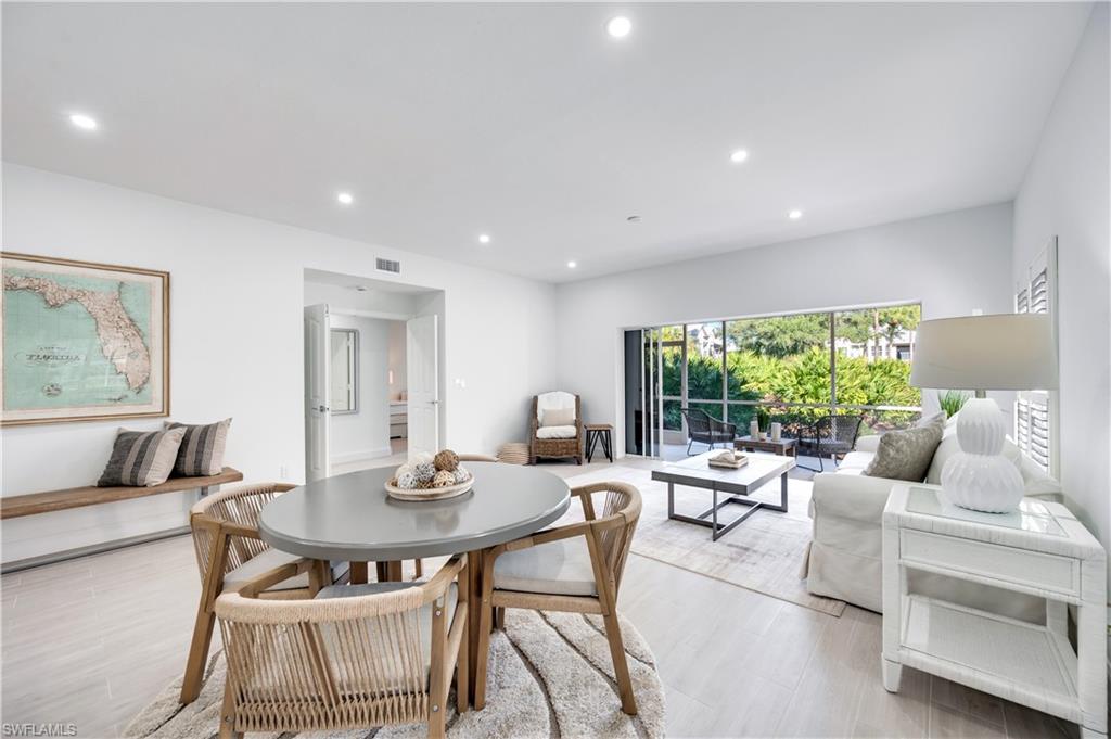 2806 Aintree Lane, Unit H102 Naples, FL 34112 - Photo 2 of 26 Dining space with recessed lighting and wood finished floors