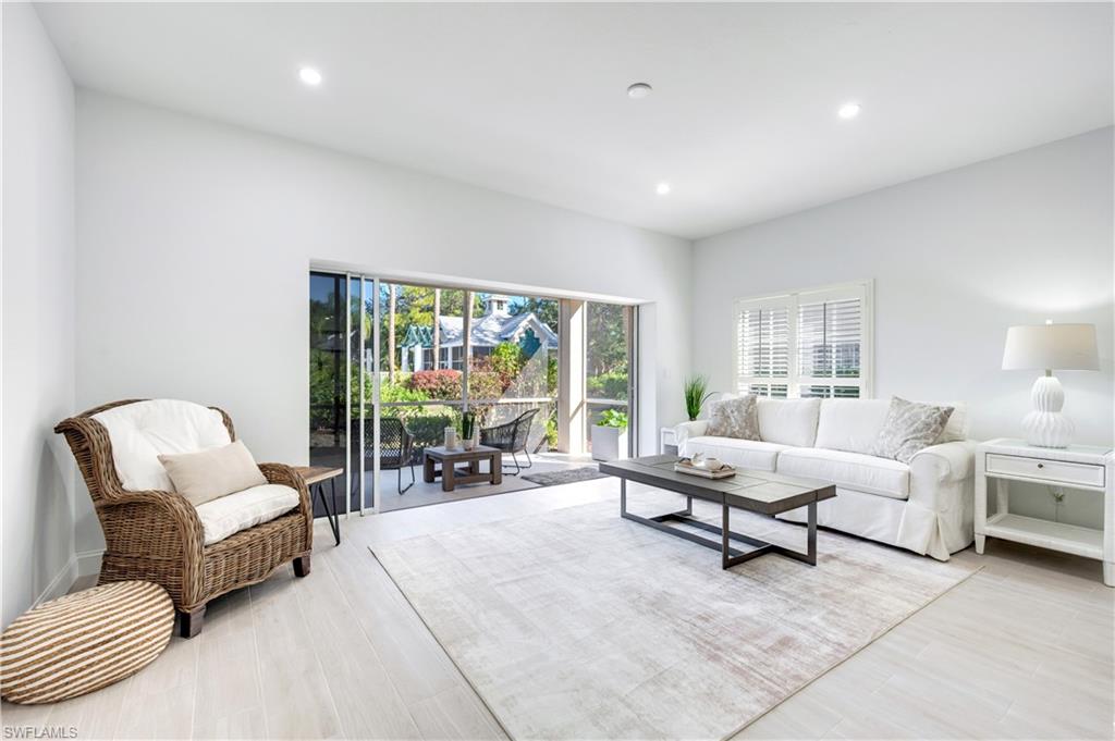 2806 Aintree Lane, Unit H102 Naples, FL 34112 - Photo 5 of 26 Living room featuring recessed lighting and light wood-style flooring