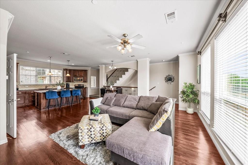 2700 Club Ridge Drive, Unit 34 Lewisville, TX 75067 - Photo 14 of 27 a living room with furniture and wooden floor
