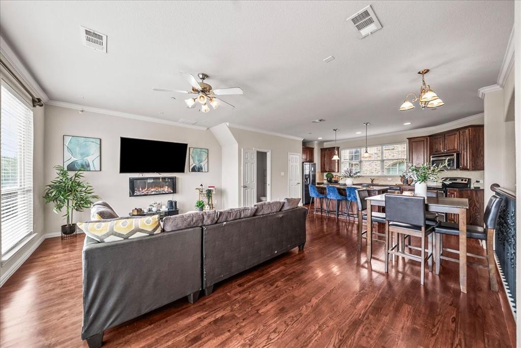 2700 Club Ridge Drive, Unit 34 Lewisville, TX 75067 - Photo 15 of 27 a living room with furniture and a flat screen tv