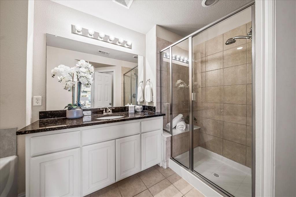 2700 Club Ridge Drive, Unit 34 Lewisville, TX 75067 - Photo 17 of 27 a bathroom with a double vanity sink mirror and shower