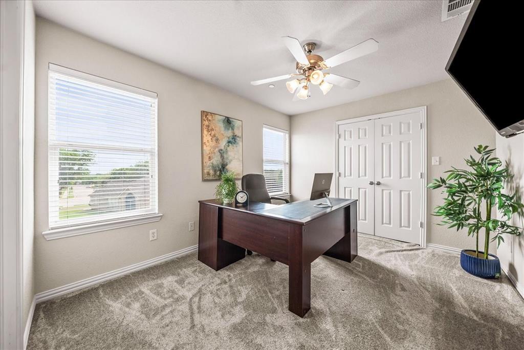 2700 Club Ridge Drive, Unit 34 Lewisville, TX 75067 - Photo 21 of 27 a dining room with furniture and window