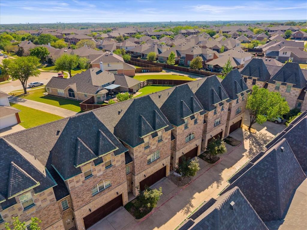 2700 Club Ridge Drive, Unit 34 Lewisville, TX 75067 - Photo 25 of 27 an aerial view of a house with a ocean view