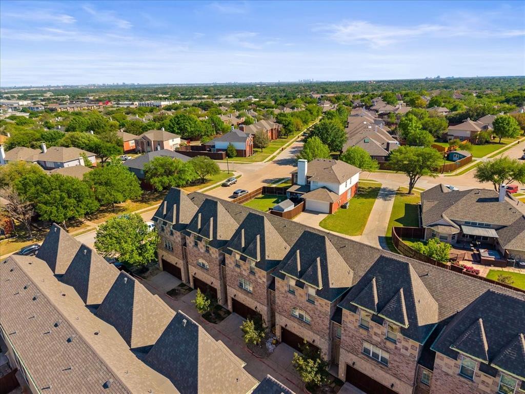 2700 Club Ridge Drive, Unit 34 Lewisville, TX 75067 - Photo 26 of 27 an aerial view of residential houses with outdoor space and ocean view