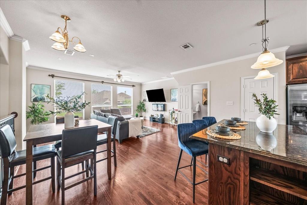 2700 Club Ridge Drive, Unit 34 Lewisville, TX 75067 - Photo 5 of 27 a dining room with furniture window and wooden floor