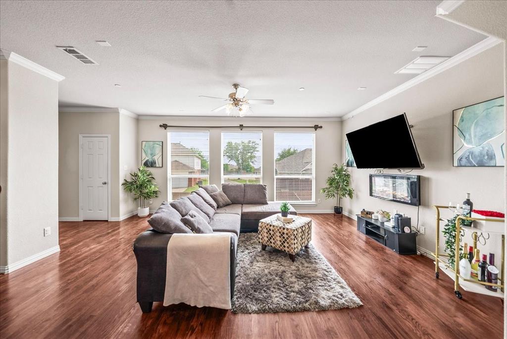 2700 Club Ridge Drive, Unit 34 Lewisville, TX 75067 - Photo 6 of 27 a living room with furniture and a flat screen tv
