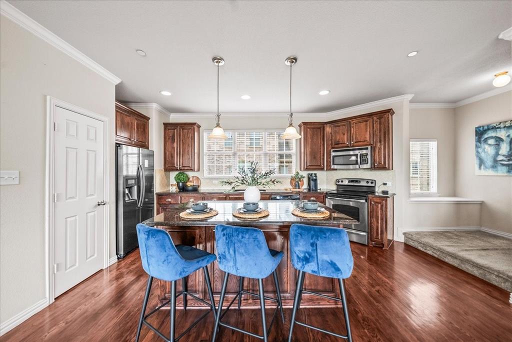 2700 Club Ridge Drive, Unit 34 Lewisville, TX 75067 - Photo 9 of 27 a view of a dining room with furniture window and wooden floor