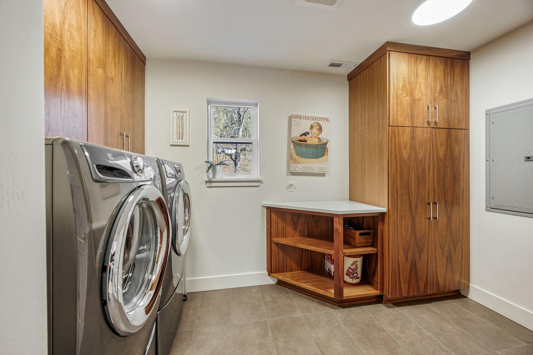 1355 Andrews Road Jacksonville, OR 97530 - Photo 27 of 66 Large laundry room w/ custom cabinets