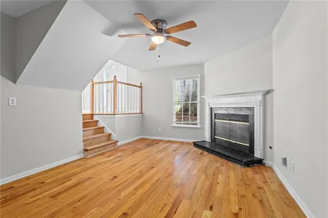 wooden floor in an empty room with a fireplace