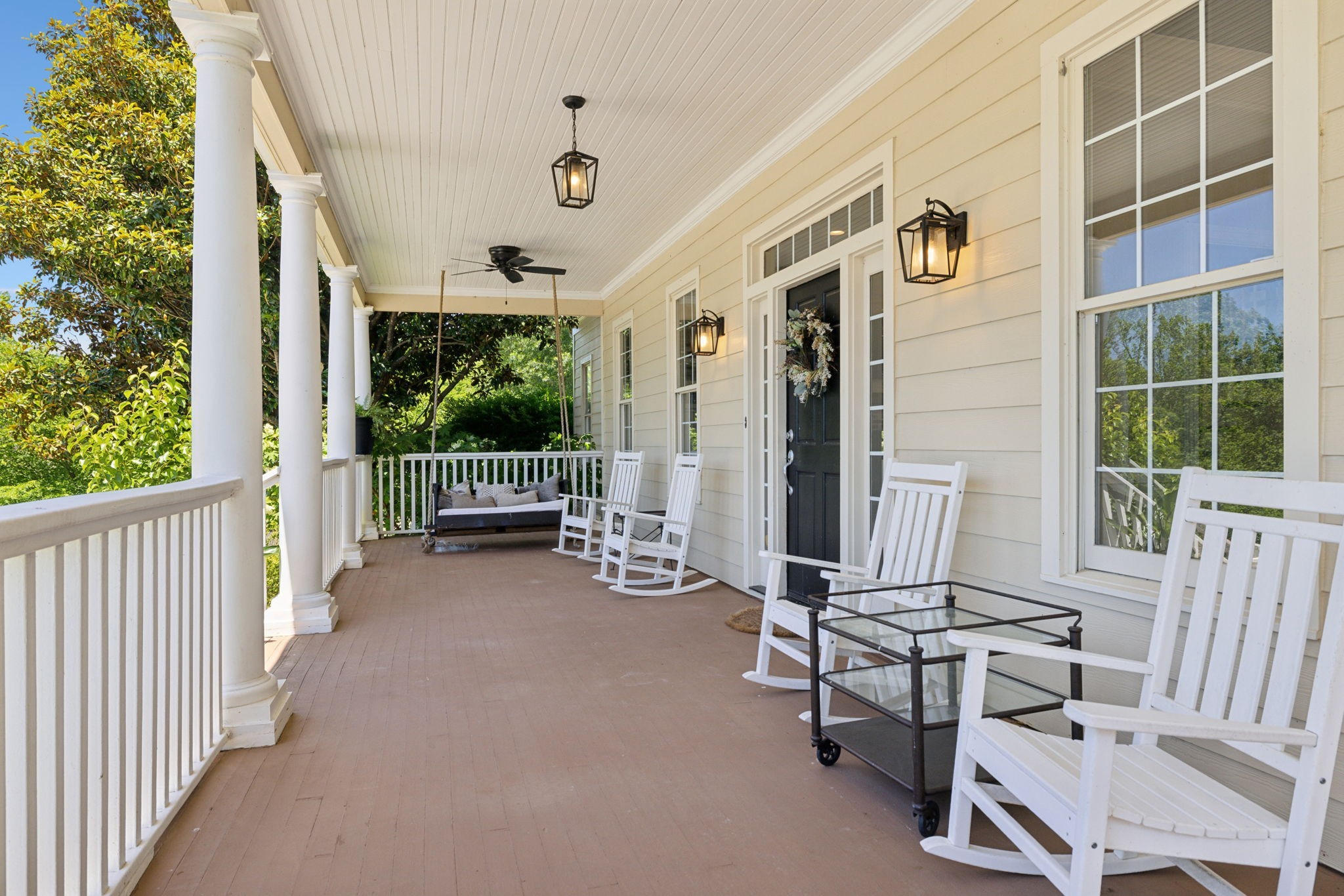 6795 Leipers Creek Road Columbia, TN 38401 - Photo 12 of 98 a view of a porch with chairs and floor to ceiling window