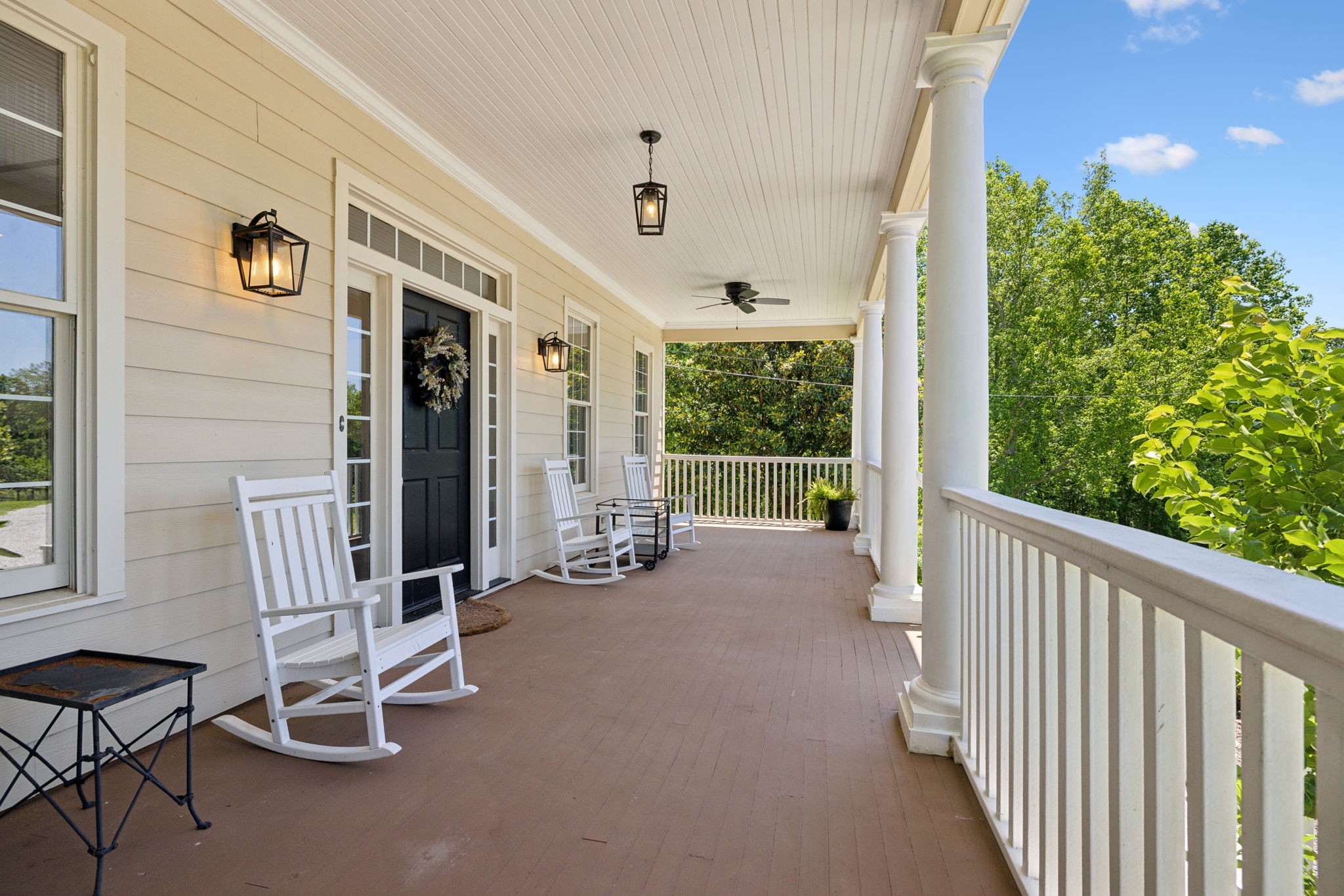 6795 Leipers Creek Road Columbia, TN 38401 - Photo 14 of 98 a view of a porch with furniture and floor to ceiling window