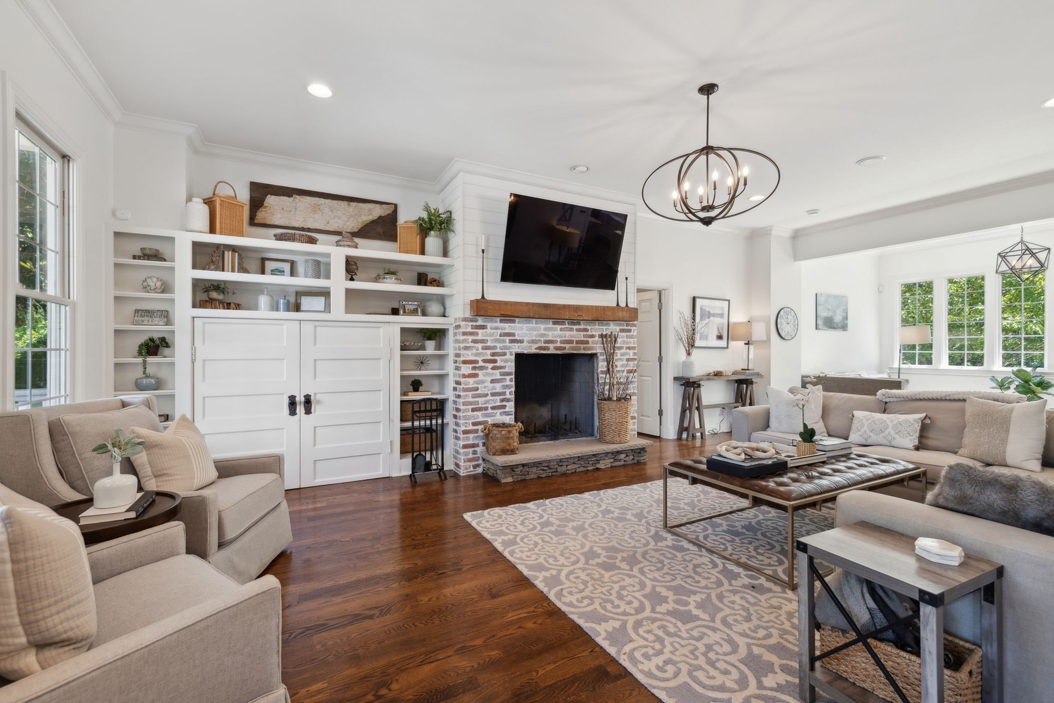 6795 Leipers Creek Road Columbia, TN 38401 - Photo 28 of 98 a living room with furniture a fireplace and a flat screen tv