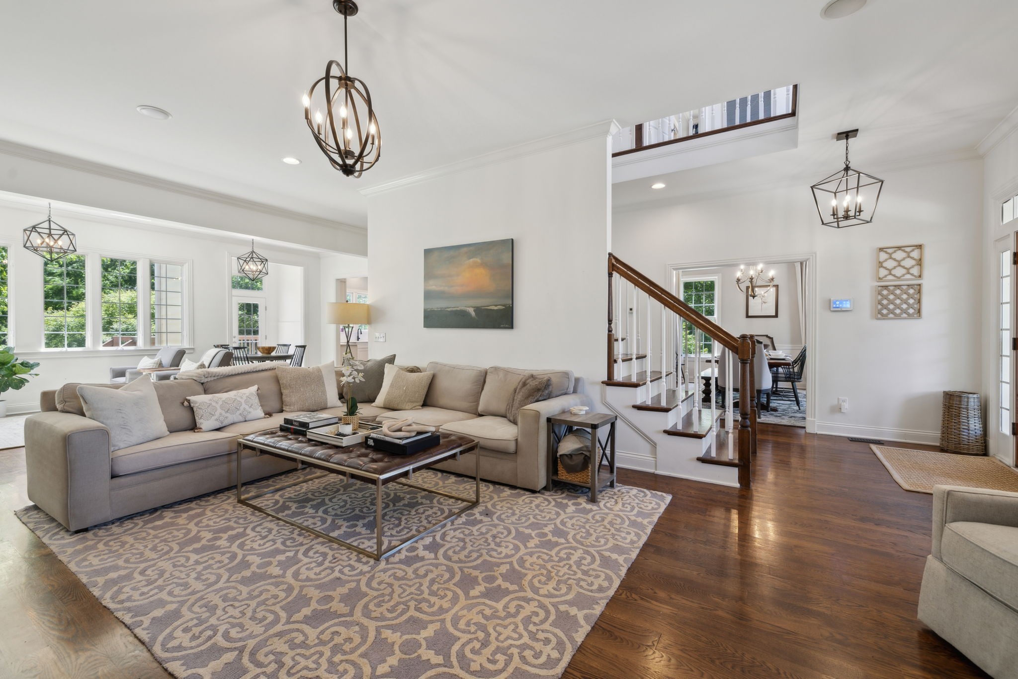 6795 Leipers Creek Road Columbia, TN 38401 - Photo 34 of 98 a living room with furniture or couches and a dining table with wooden floor
