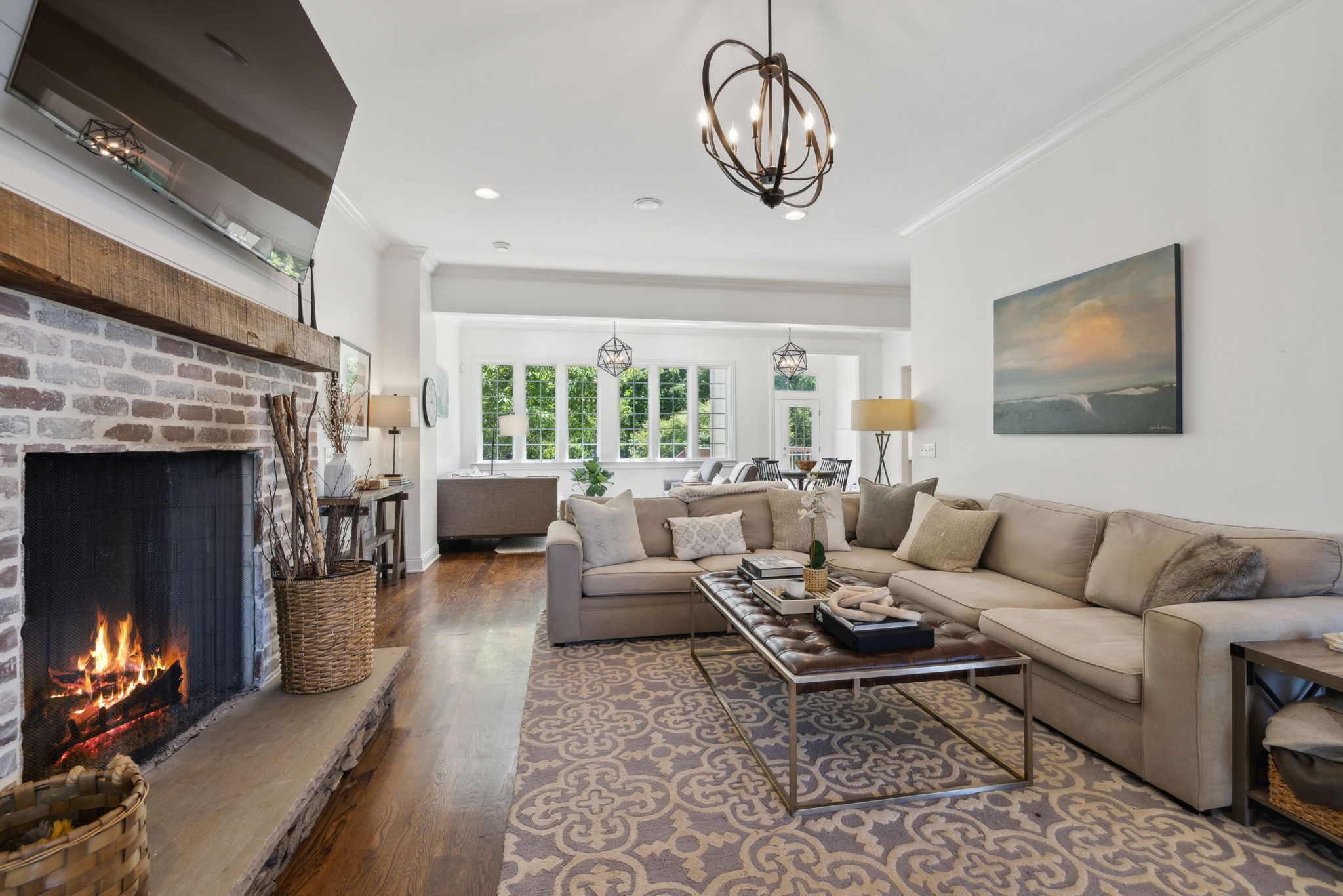 6795 Leipers Creek Road Columbia, TN 38401 - Photo 35 of 98 a living room with furniture a fireplace and a flat screen tv