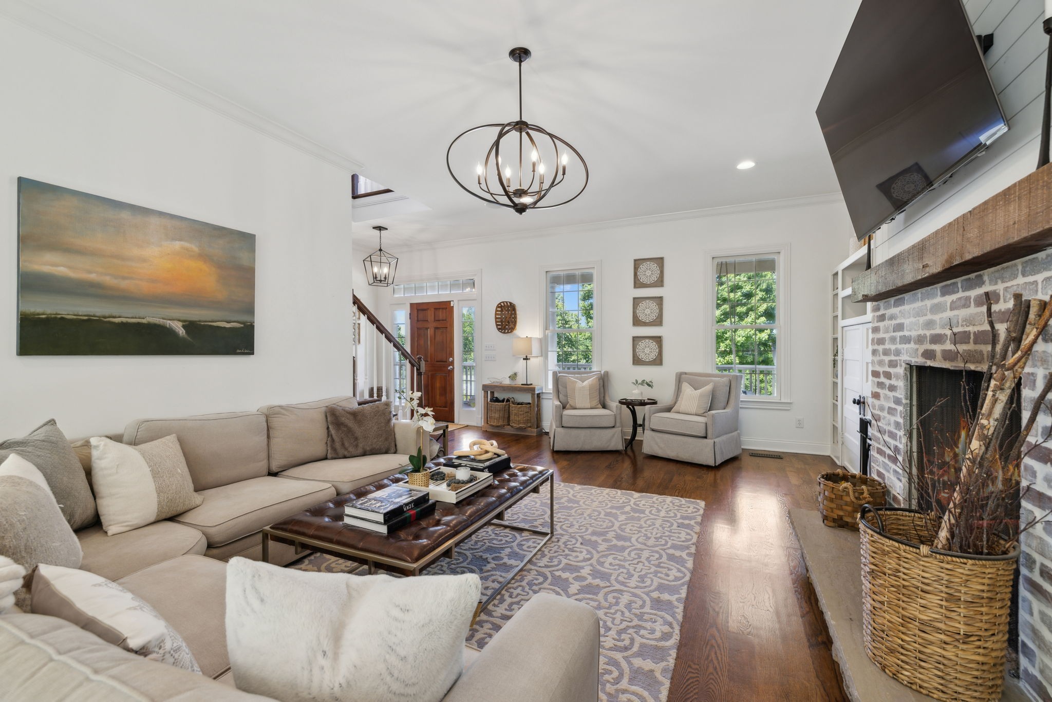 6795 Leipers Creek Road Columbia, TN 38401 - Photo 36 of 98 a living room with furniture a fireplace and a flat screen tv